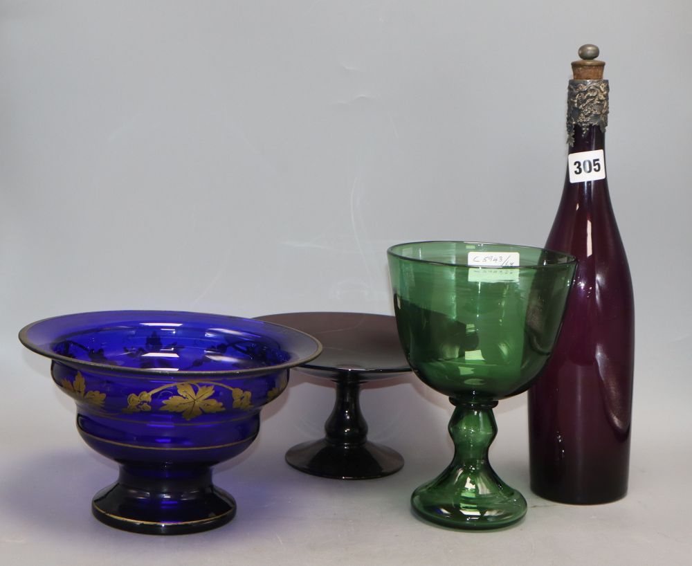 A Victorian silver-mounted Victorian coloured glass decanter, a tazza, a green glass and a blue bowl (4)